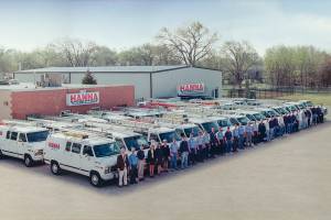 Fleet of Hanna HVAC vehicles outside Wichita location from the 90s