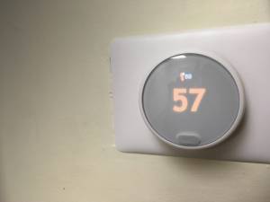 thermostat showing 57 degrees, indicating a broken heater. Something to check when your furnace stops working