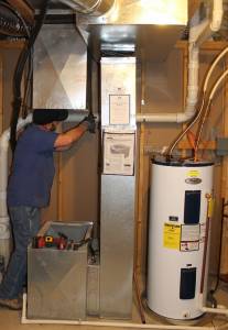 Photo Hanna Heating & Air technician working on a furnace making odd sounds