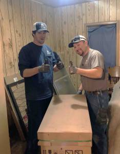 Photo of Hanna HVAC technicians installing a new furnace as part of a Holiday program benefitting Wichita veterans