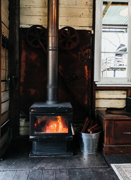 Old fashioned wood fired heat unit in history of home heating