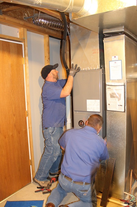 Hanna HVAC technicians doing installation in Wichita home