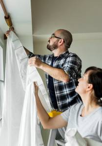 Hanging curtains helps to keep a poorly insulated house warm